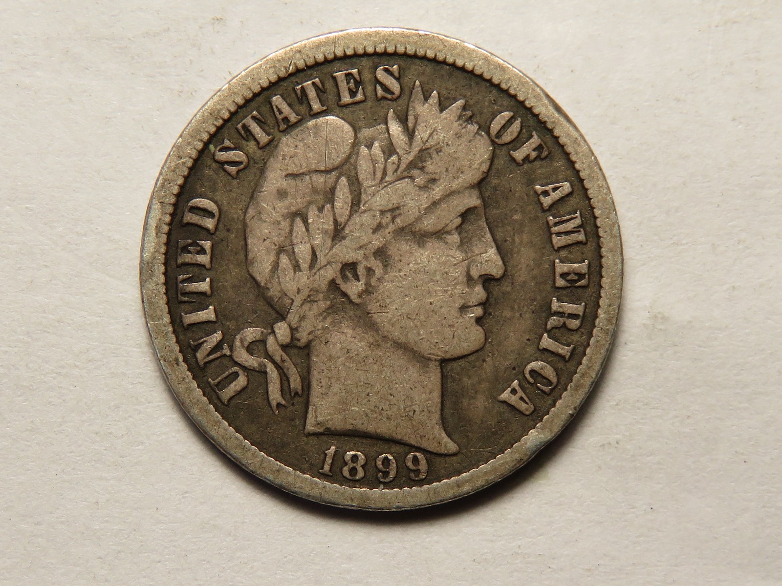 1899-O Barber Dime, Fine, Small Rim Ding