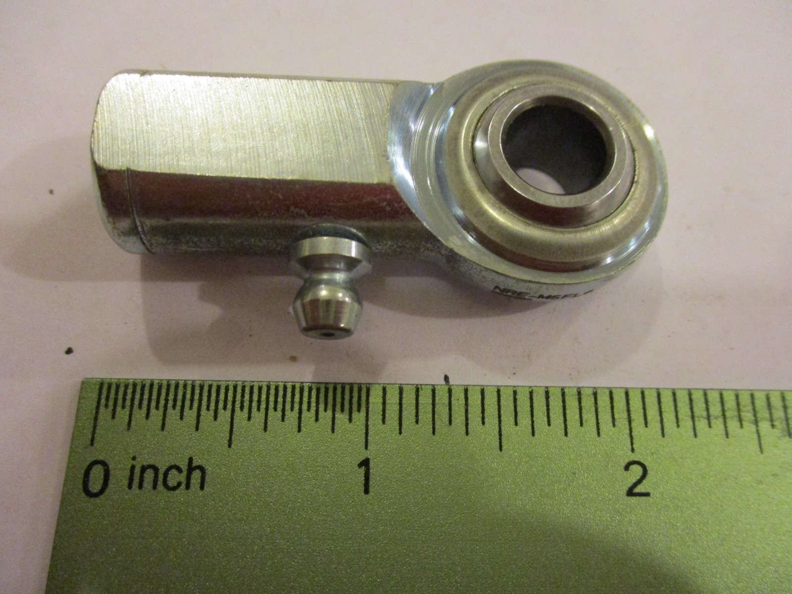 3/8" female rod end.  Left hand 3/8-24 thread. With grease fitting.