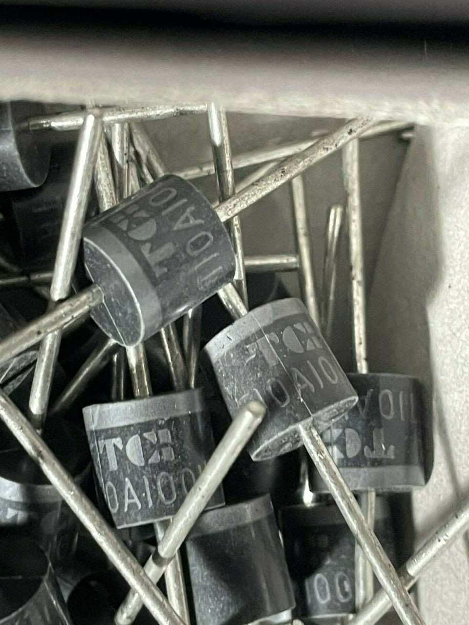 A lot of 10 TAITRO Components, T10A100L,  10A, 1000 V axial lead rectifier.