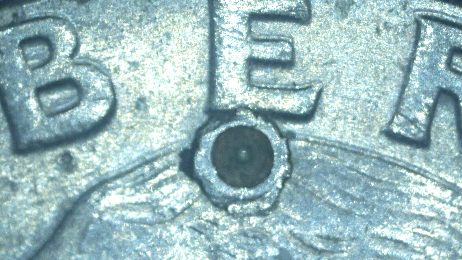 1991 Washington Quarter with a (strike through)