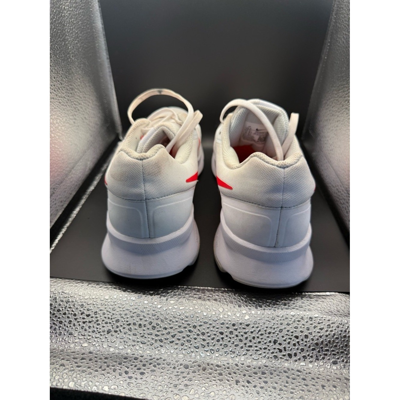Nike White Athletic Shoes with Red Swoosh