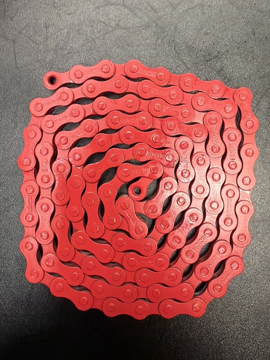 Red KMC Bicycle chain 1 speed 1/2x 1/8 112L