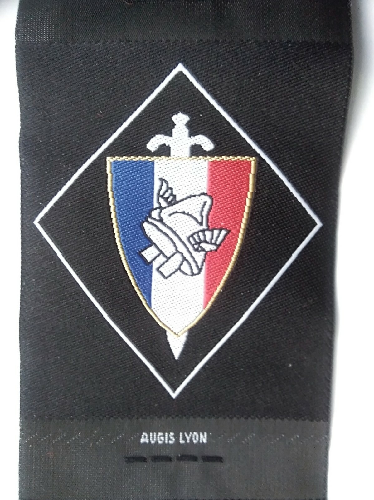 FRENCH COMBATTANTS WOVEN ARM BADGE MARKED AUGIS LYON.