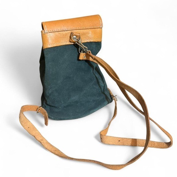 Forest Green Suede and Tan Leather backpack with adjustable straps.