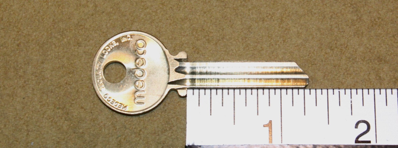 Medeco blank ( genuine ) uncut round headed key  - New