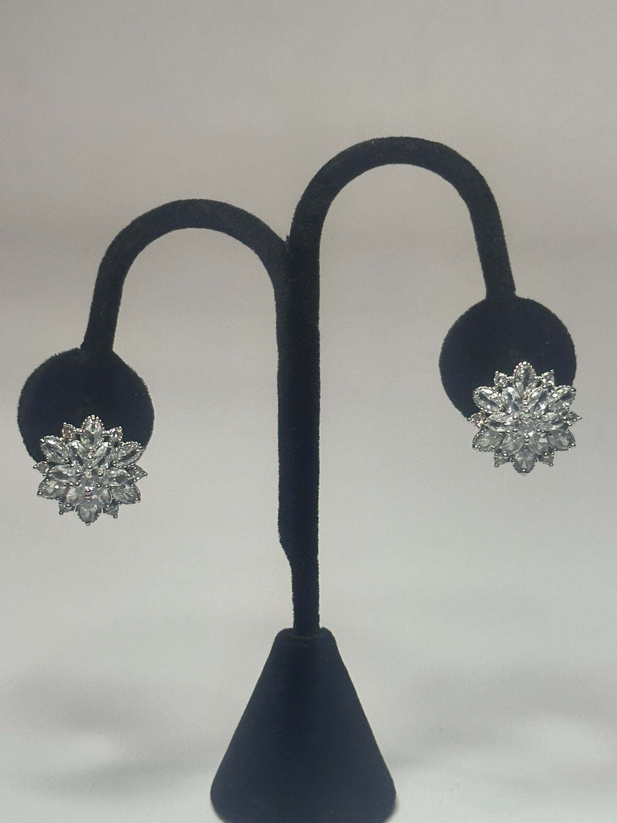 Silver Tone Metal Flower Studded Earrings With Glass Stones