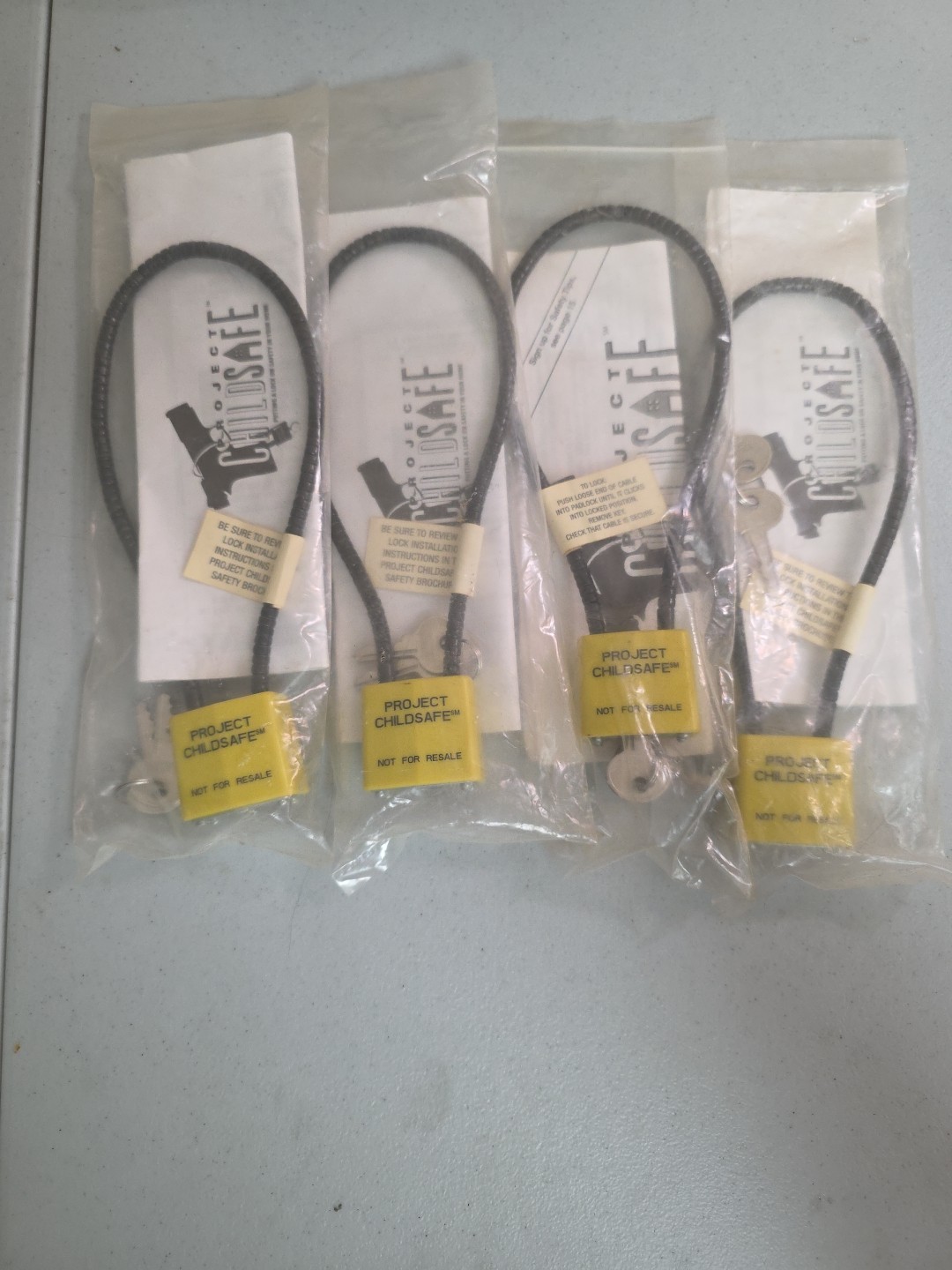 Child GUN SAFETY LOCKS Safe Firearm Metal Cable 2 Keys Each Black SET FOUR