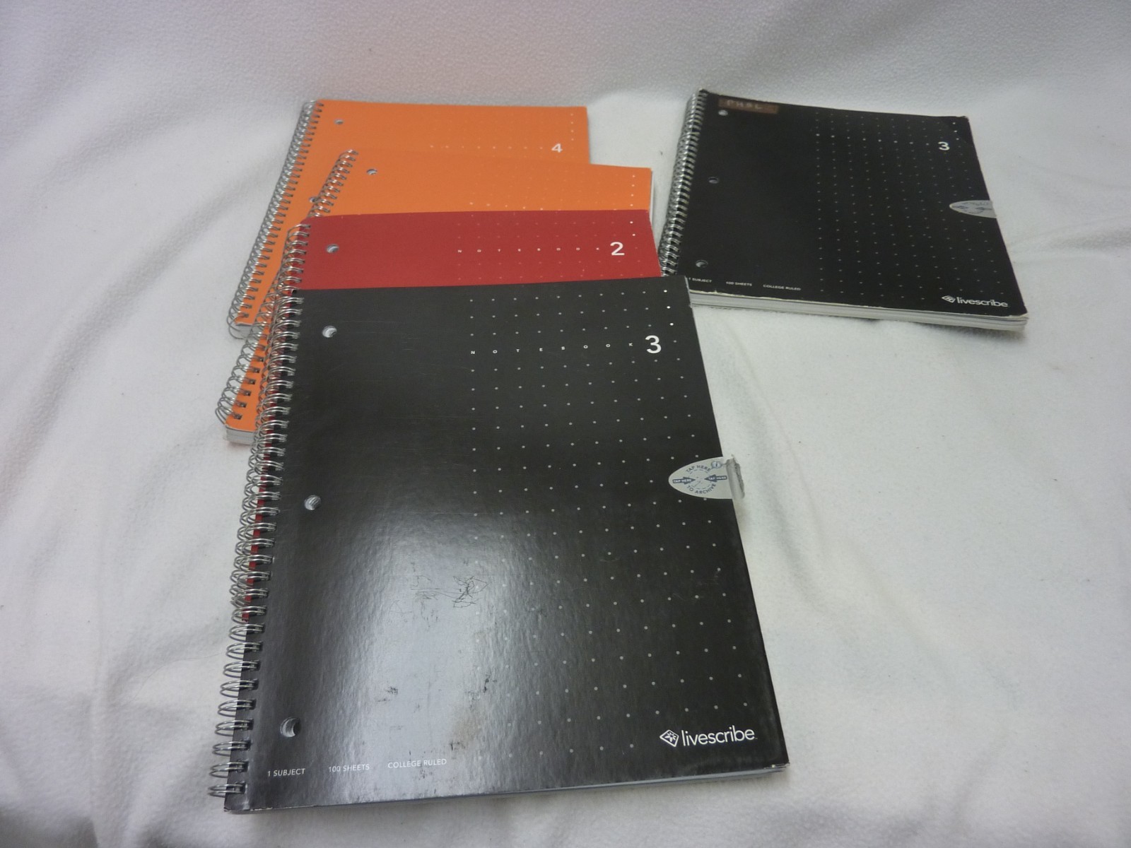 FOUR LIVESCRIBE NOTEBOOKS - COMPLETE PLUS ONE PARTIAL LIVESCRIBE NOTEBOOK