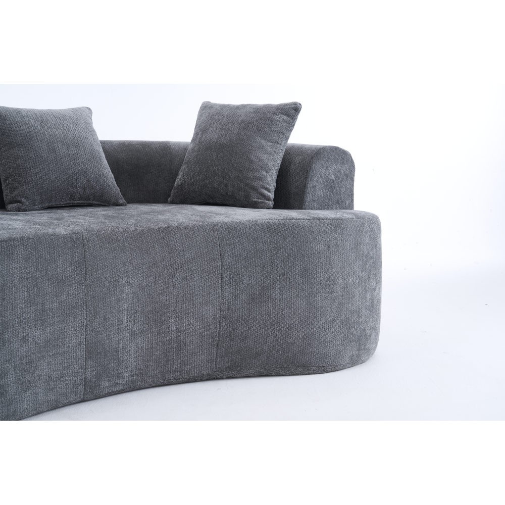 Crescent-shaped sofa, modern low-back design with deep cushions, self-inflating