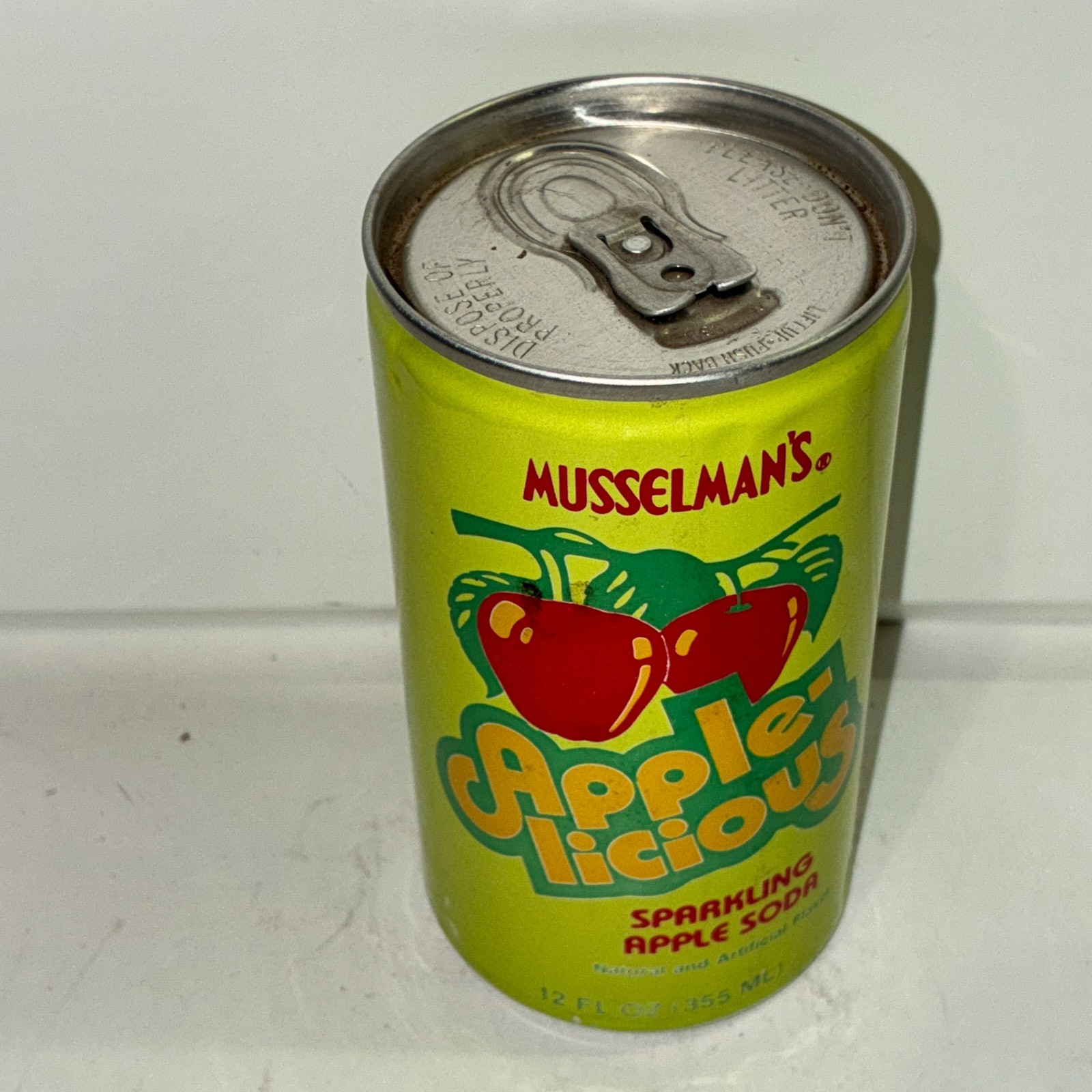 Musselman's Apple-licious Apple soda can, bottom opened