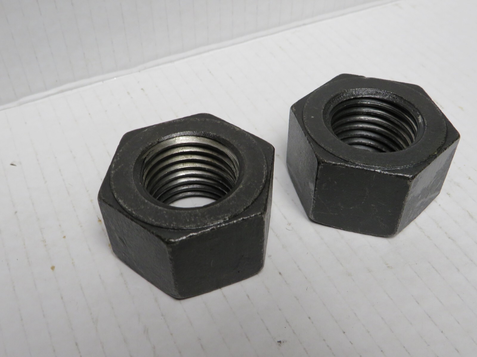 2 NUTS ) 1-1/4"-8 THREAD, STEEL, GRADE 2H,  HEAVY HEX NUTS, RH, BLACK OXIDE