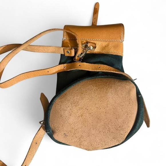 Forest Green Suede and Tan Leather backpack with adjustable straps.