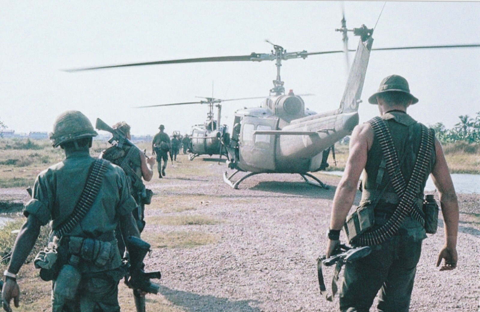 Vietnam  War  Photo --    Soldier Loading On To Hueys