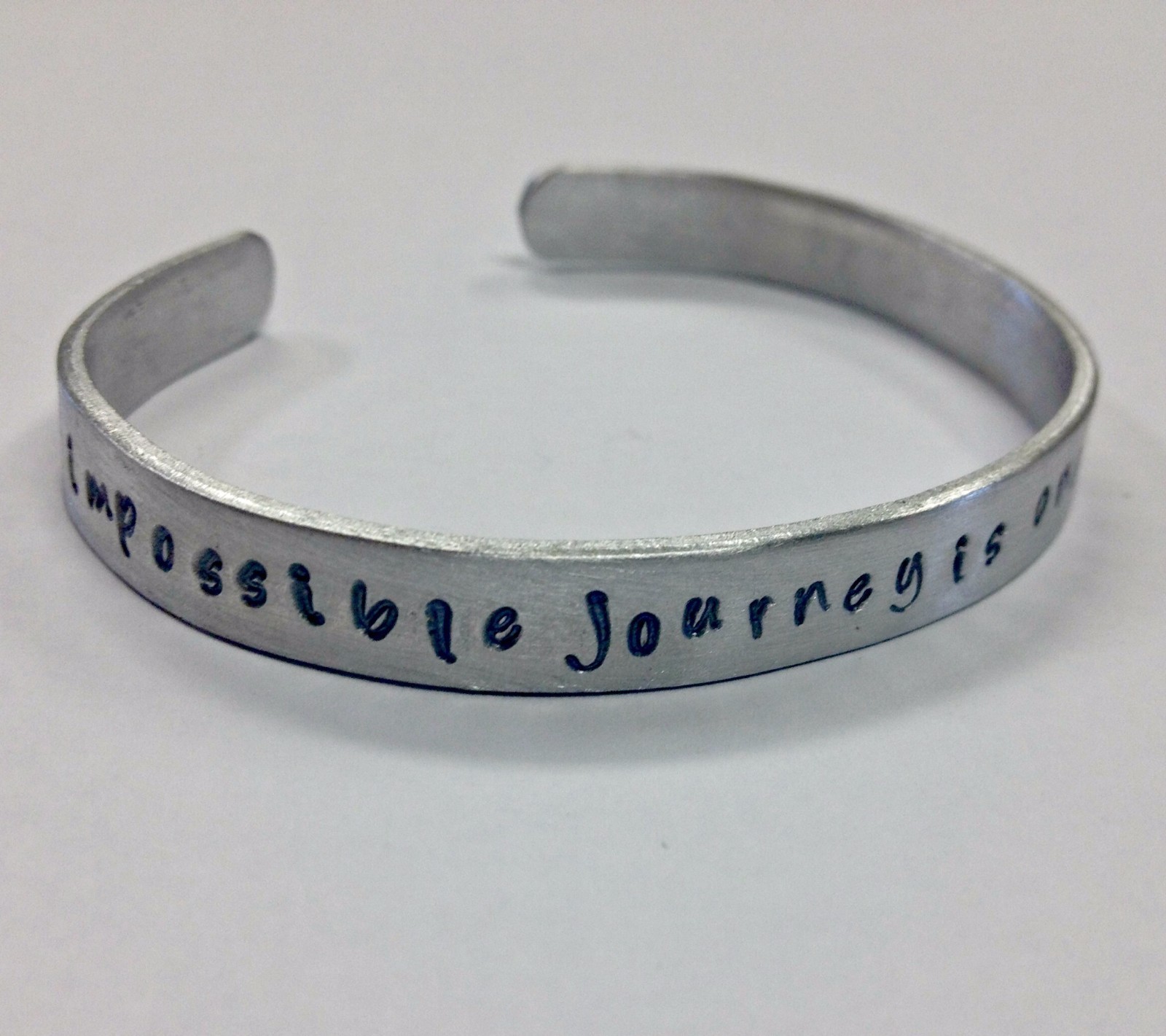 The only impossible journey....FREE SHIPPING handstamped cuff bracelet