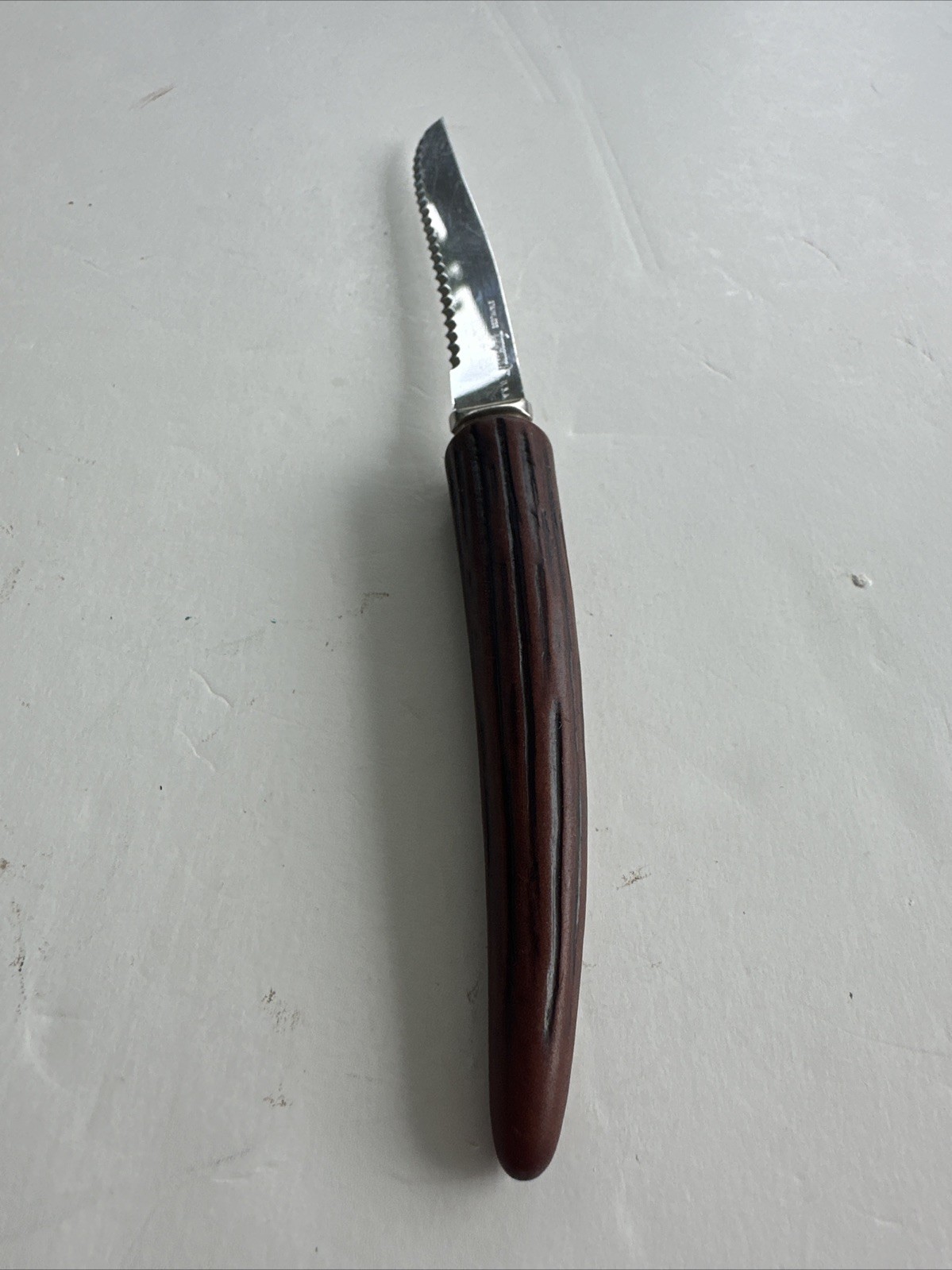 Vintage Forgecraft Stainless 8 3/4” Serrated Blade Knife Faux Antler Horn Handle
