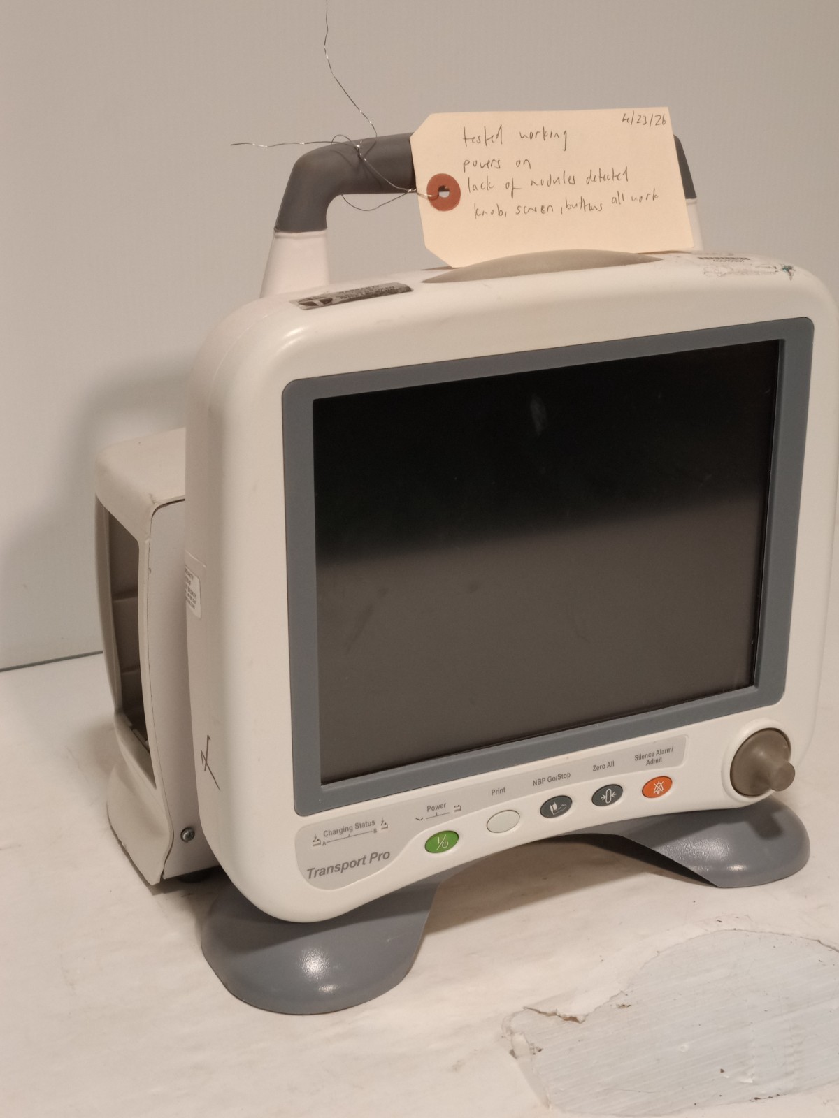 GE Transport Pro portable patient monitor, 10.4in display, powers on, no modules