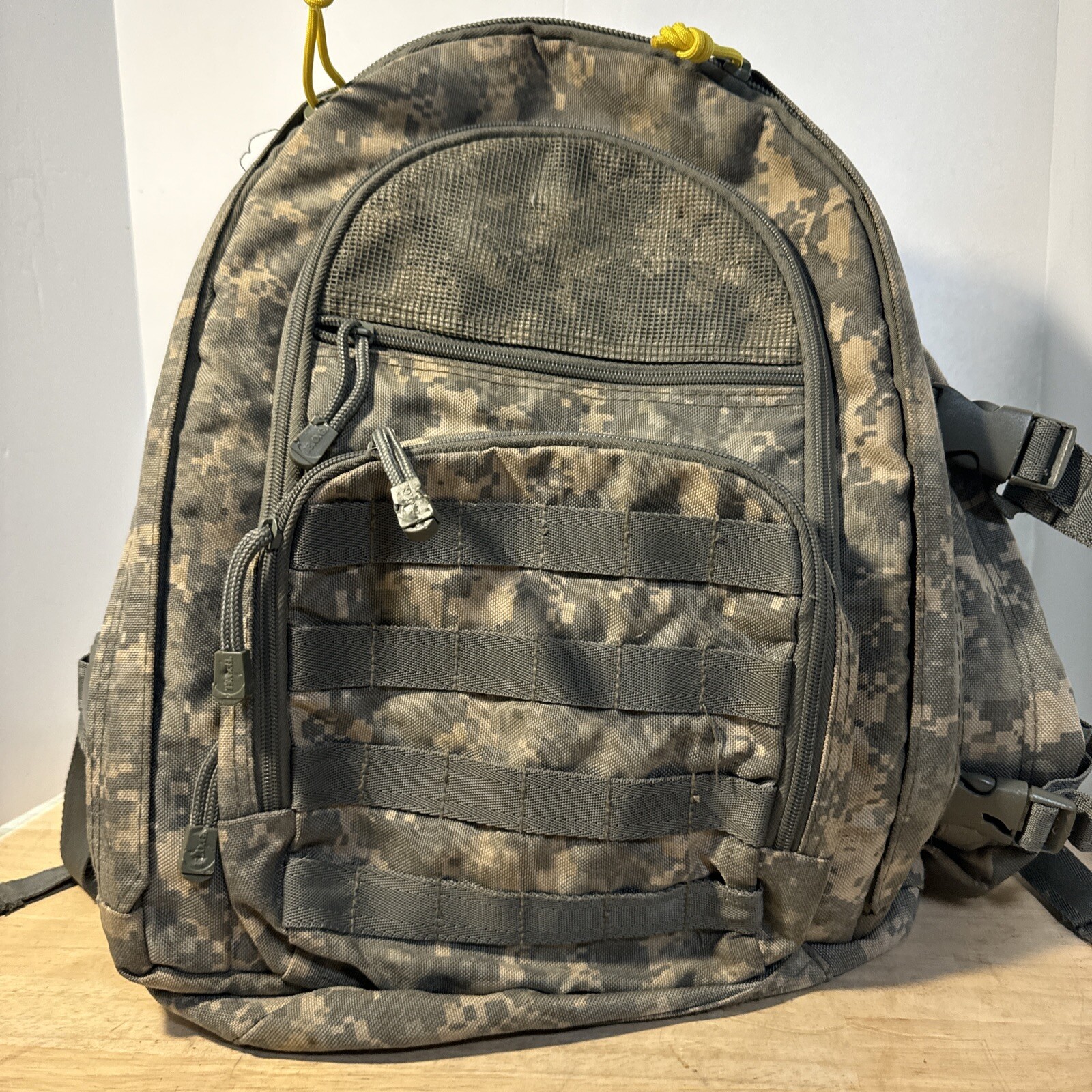 Bug Out Brand 3DAY Pack and very good condition. Lots of zipper storage areas.