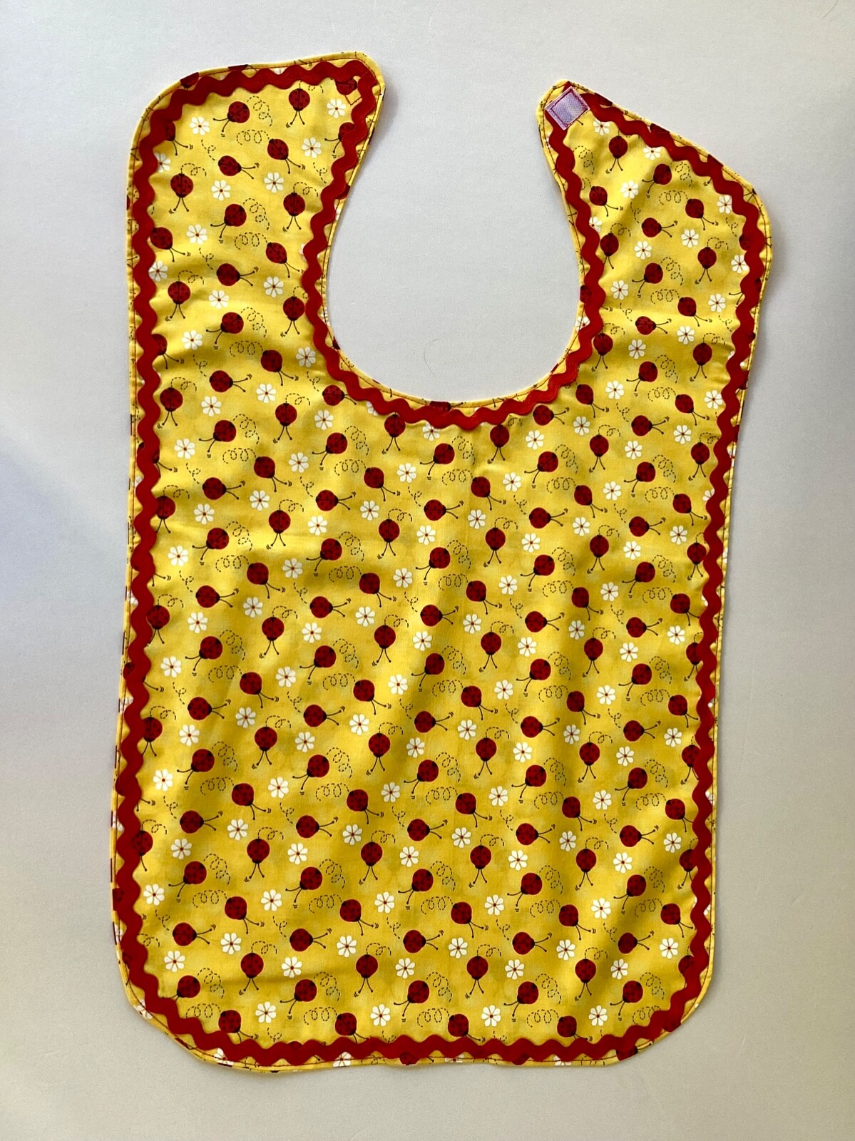 ADULT CLOTHING PROTECTOR BIB (LADY BUGS)