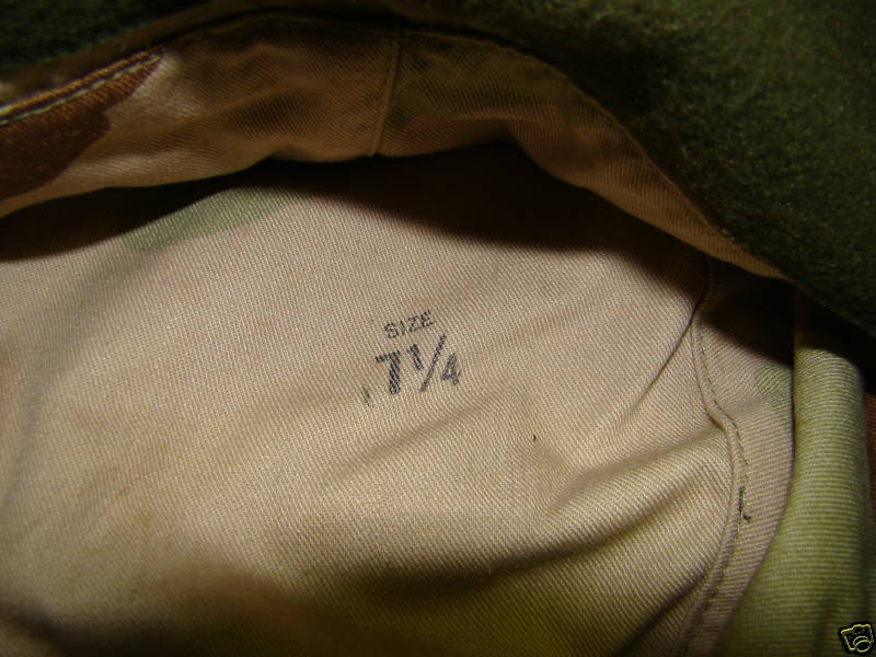 Tan Camouflage Hat with Ear Flaps.