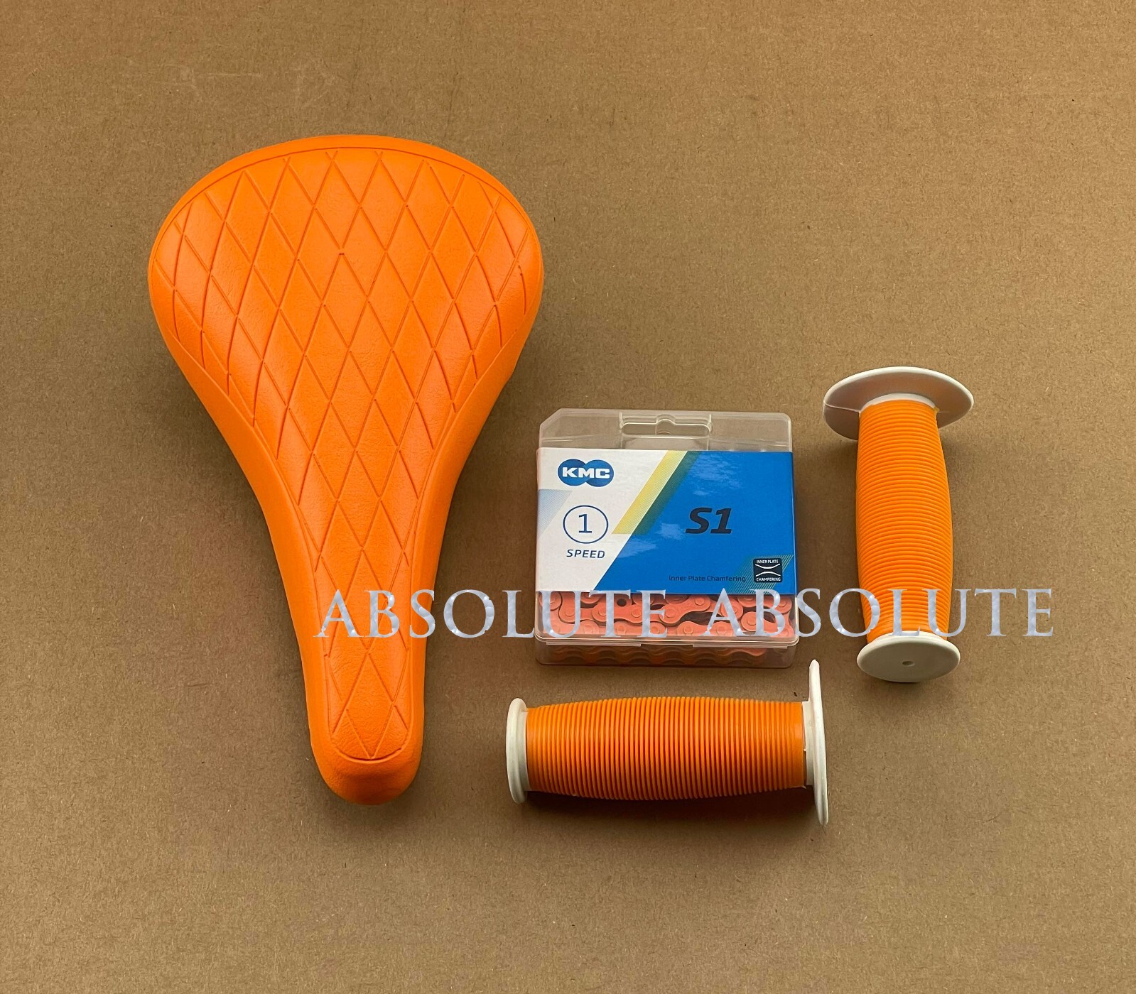 ORANGE DIAMOND STITCHED BMX BIKE SADDLE W/ BMX KMC CHAIN & MUSHROOM STYLE GRIPS.