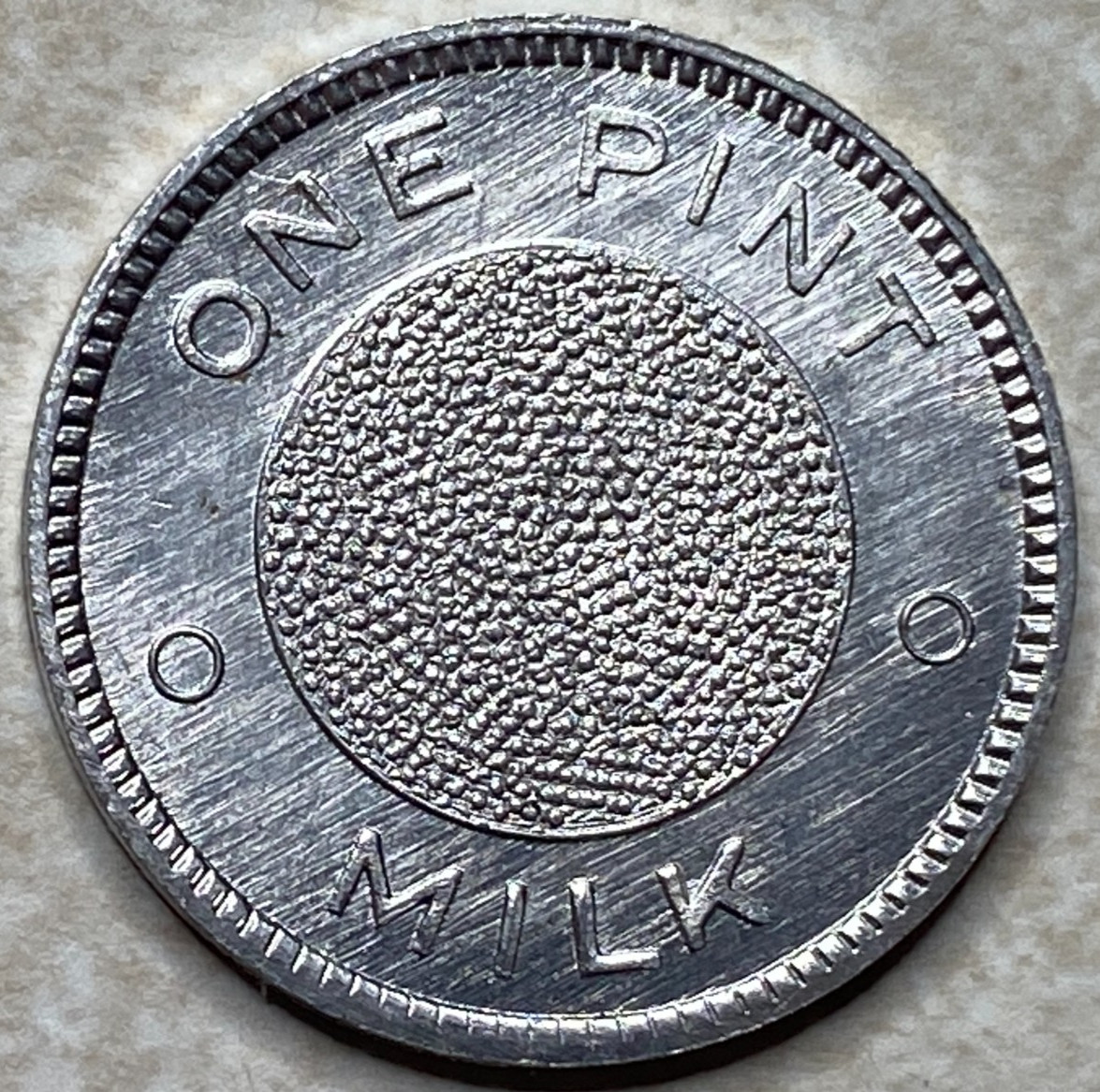 T9106 One Pint Milk, Unknown  Anillo Restrike Arcade Token