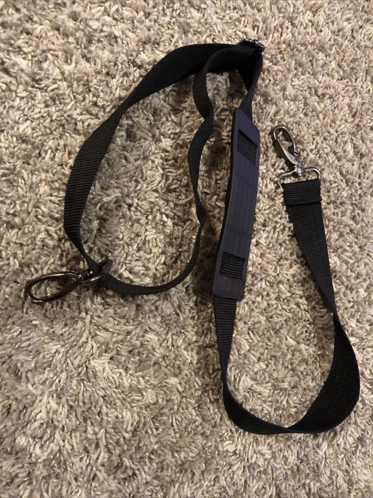 Adjustable Bag Strap ￼ Black nylon, metal hardware,￼ about 32-42” Duffel Luggage