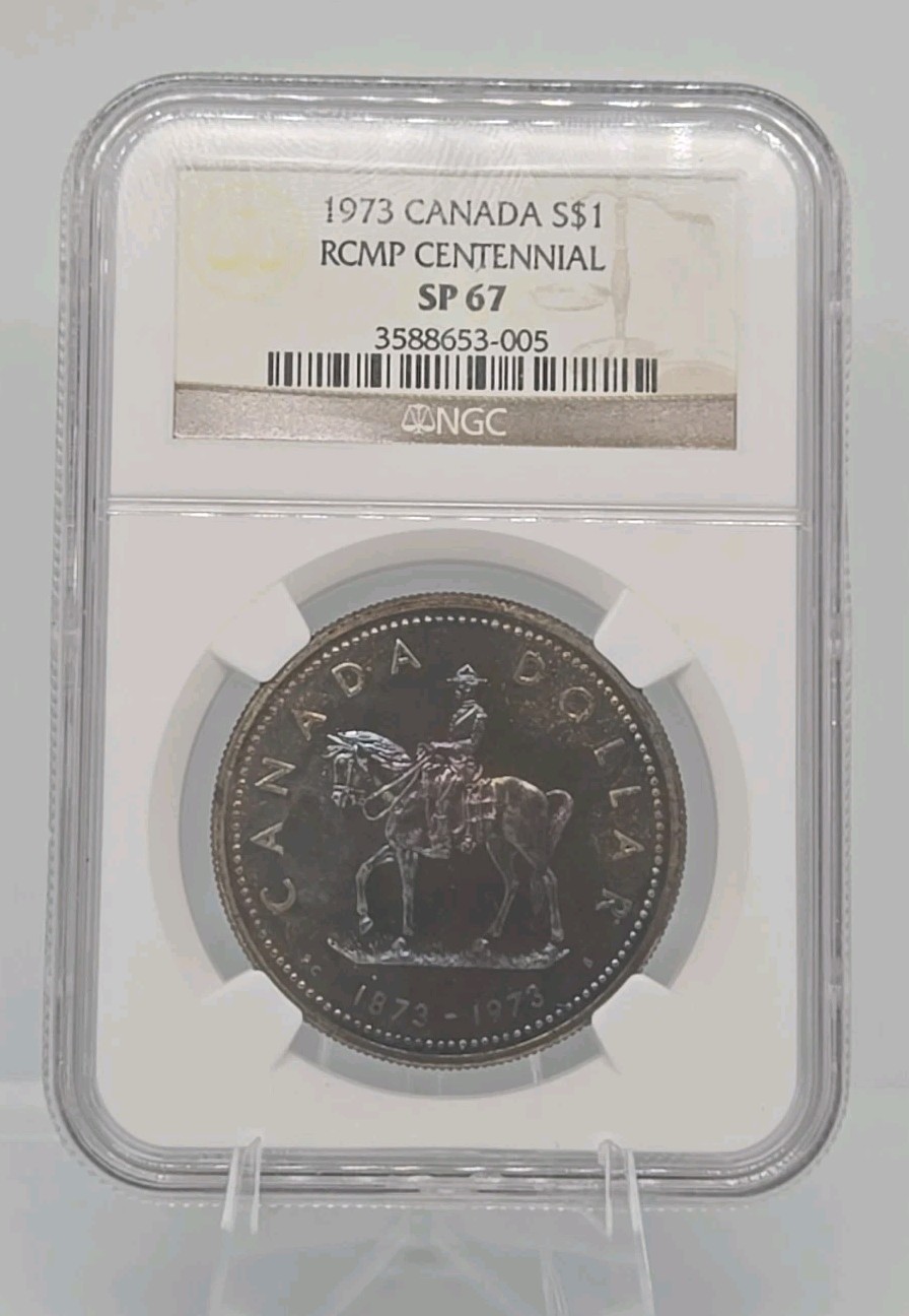 1973 CANADA SILVER $1 RCMP CENTENNIAL NGC SP67 With Toning