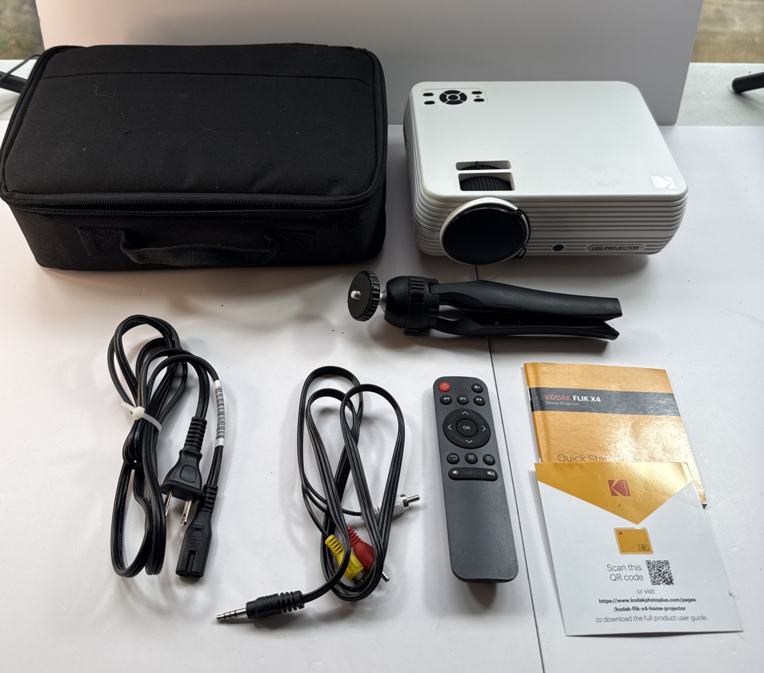Kodak FLIK X4 Home Projector. Includes Cords, Remote, Tripod, Orig Book& Case