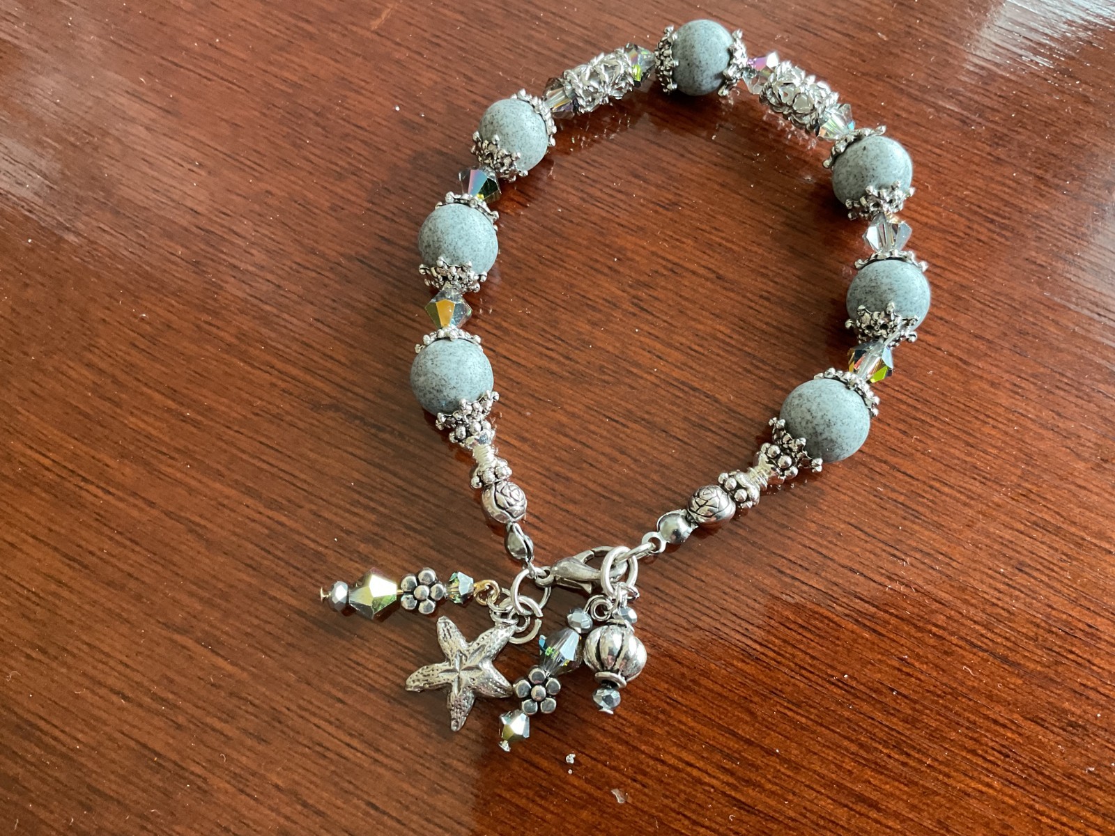 BEAUTIFUL HANDMADE BRACELET  BLUE JASPER  AND CRYSTAL ENHANCED WITH CHARMS