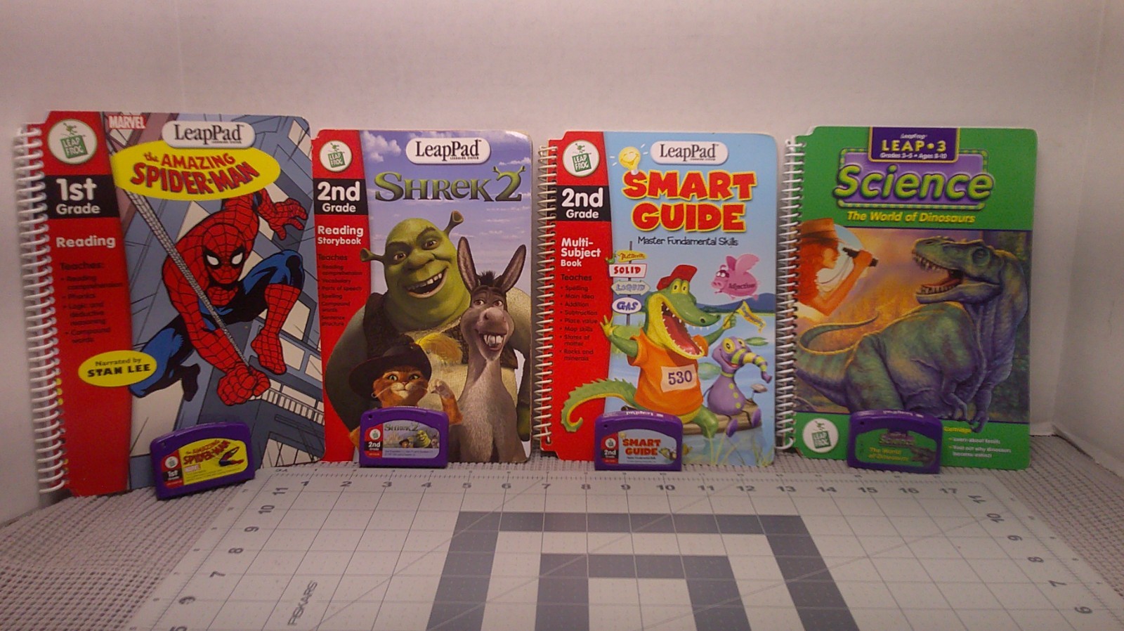 LeapPad Interactive 4 Books And Cartridges.  Grade 1-3