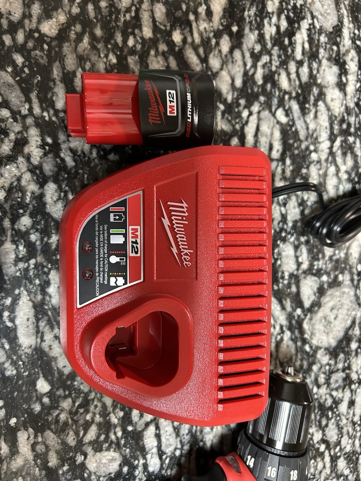 Milwaukee drill, battery, and charger