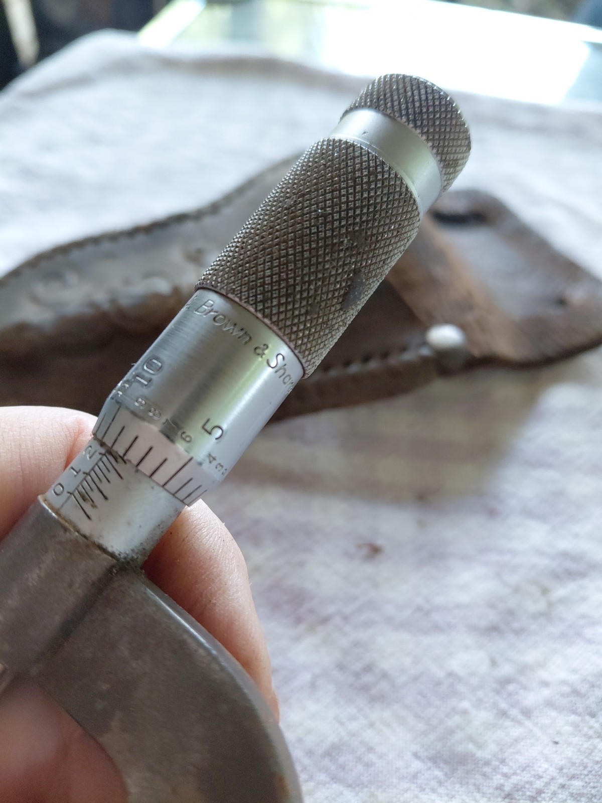 brown sharp micrometer and leather pouch