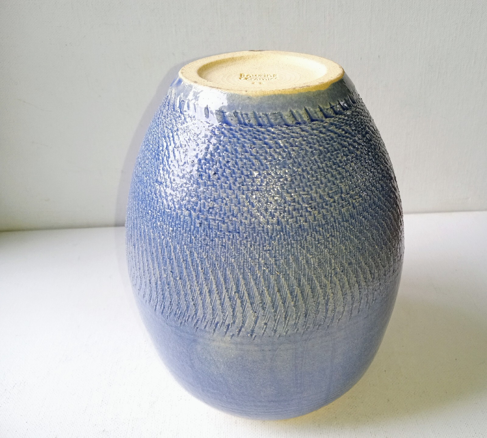 Bowring Ceramics Ginger Jar with lid. Light blue with impressed design.