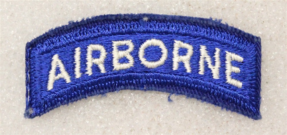 Army patch 5085: "AIRBORNE" tab - white on blue w/cut edge