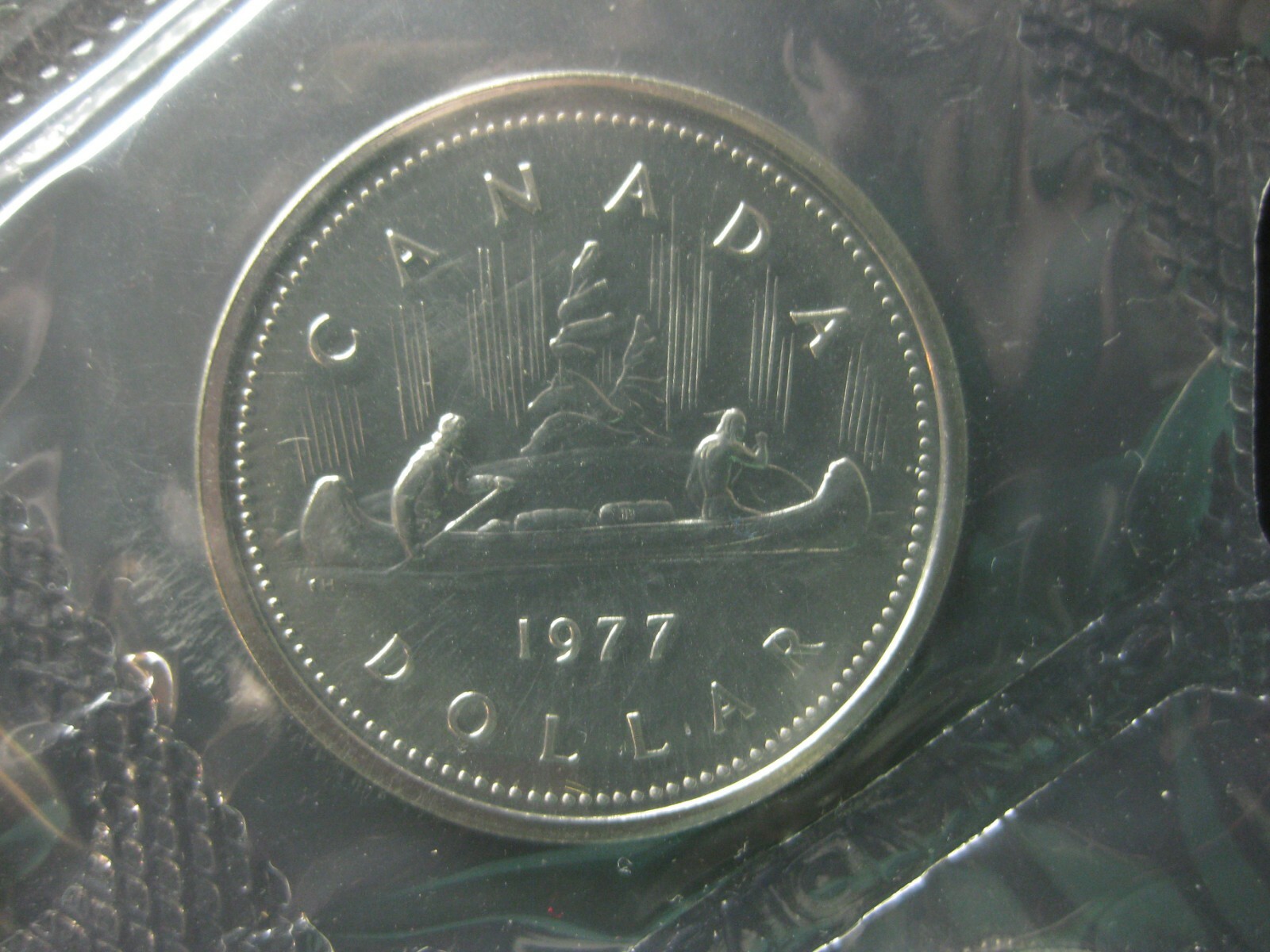1977 Canadian Prooflike Nickel Dollar ($1.00) - Full Water Line Variety