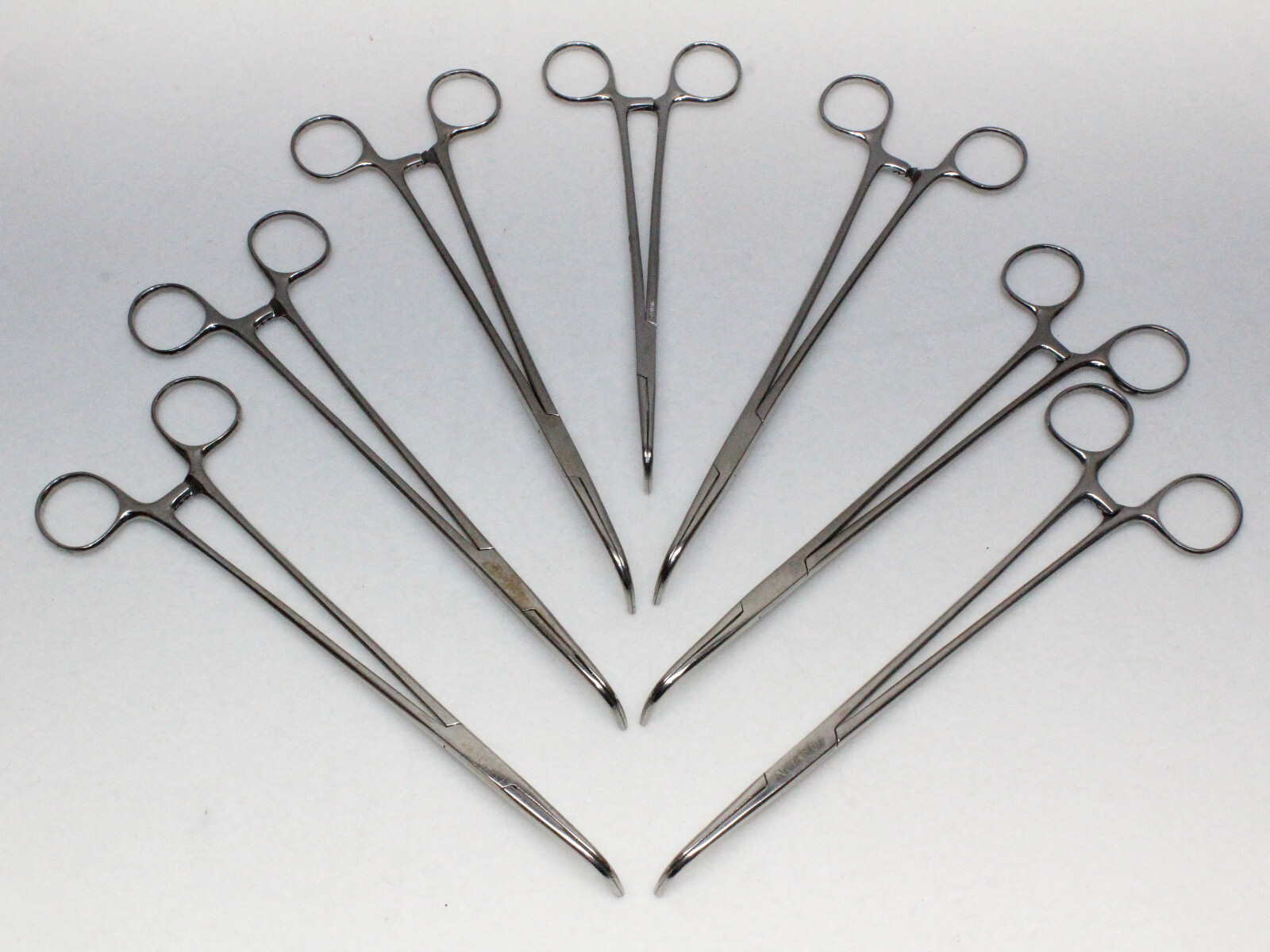 LOT OF 7 Lawton Curved Serrated Locking Forceps Ranging from 7½"-9"