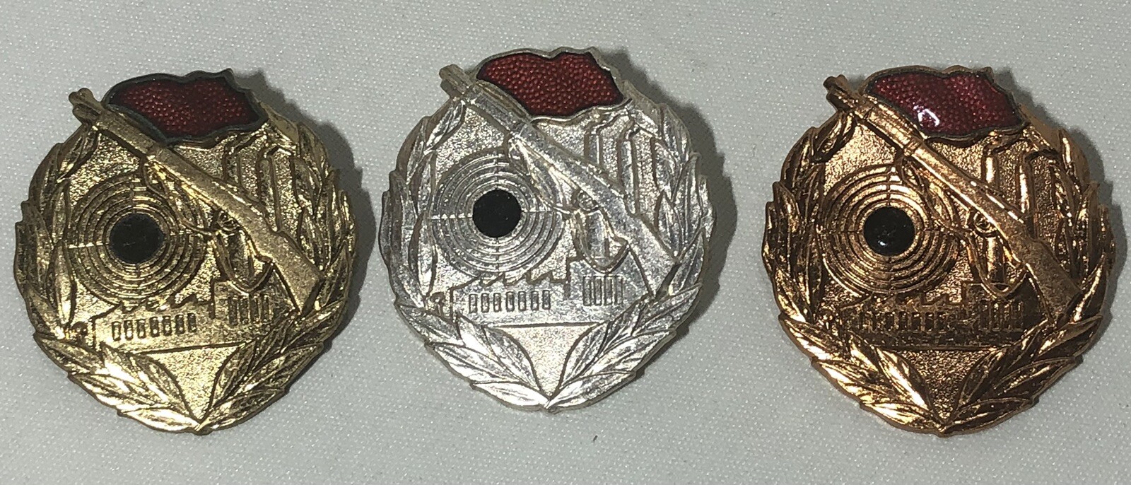 EAST GERMAN KAMPFGRUPPEN SHOOTING BADGE SET OF 3 - GOLD, SILVER, BRONZE