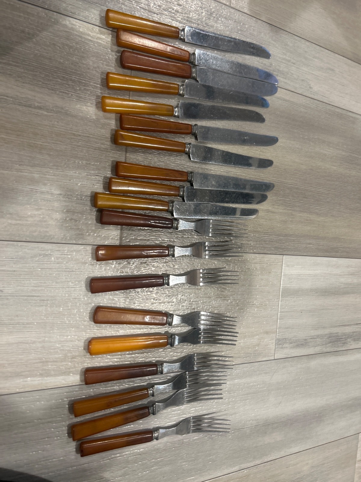 vintage Bakelite handled flatware pieces, typically dating from the 1930s or 50s