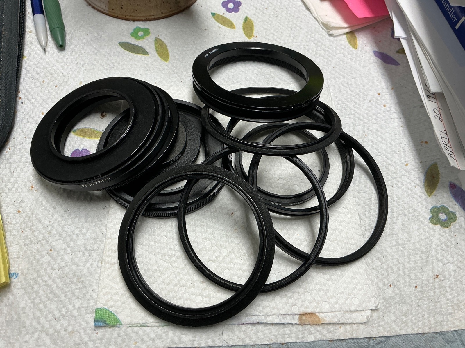 Group of 16 camera step up rings, mostly aluminum...assorted sizes and brands