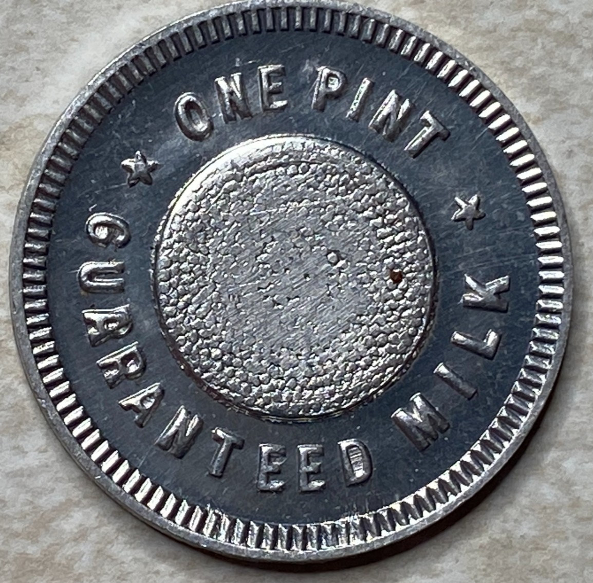T9253 One Pint Guaranteed Milk, Unknown  Anillo Restrike Arcade Token