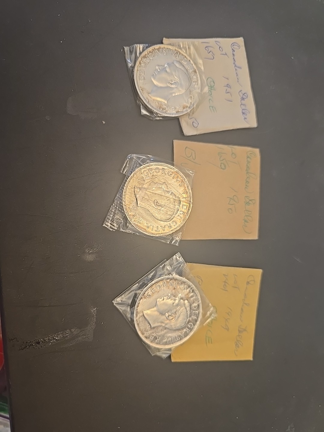1949, 1950,1951  canada silver dollars.  BU Original Packaging