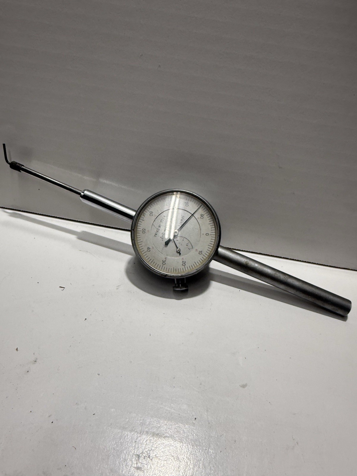 Dial indicator designed for precision measurements in machining, featuring 0.001