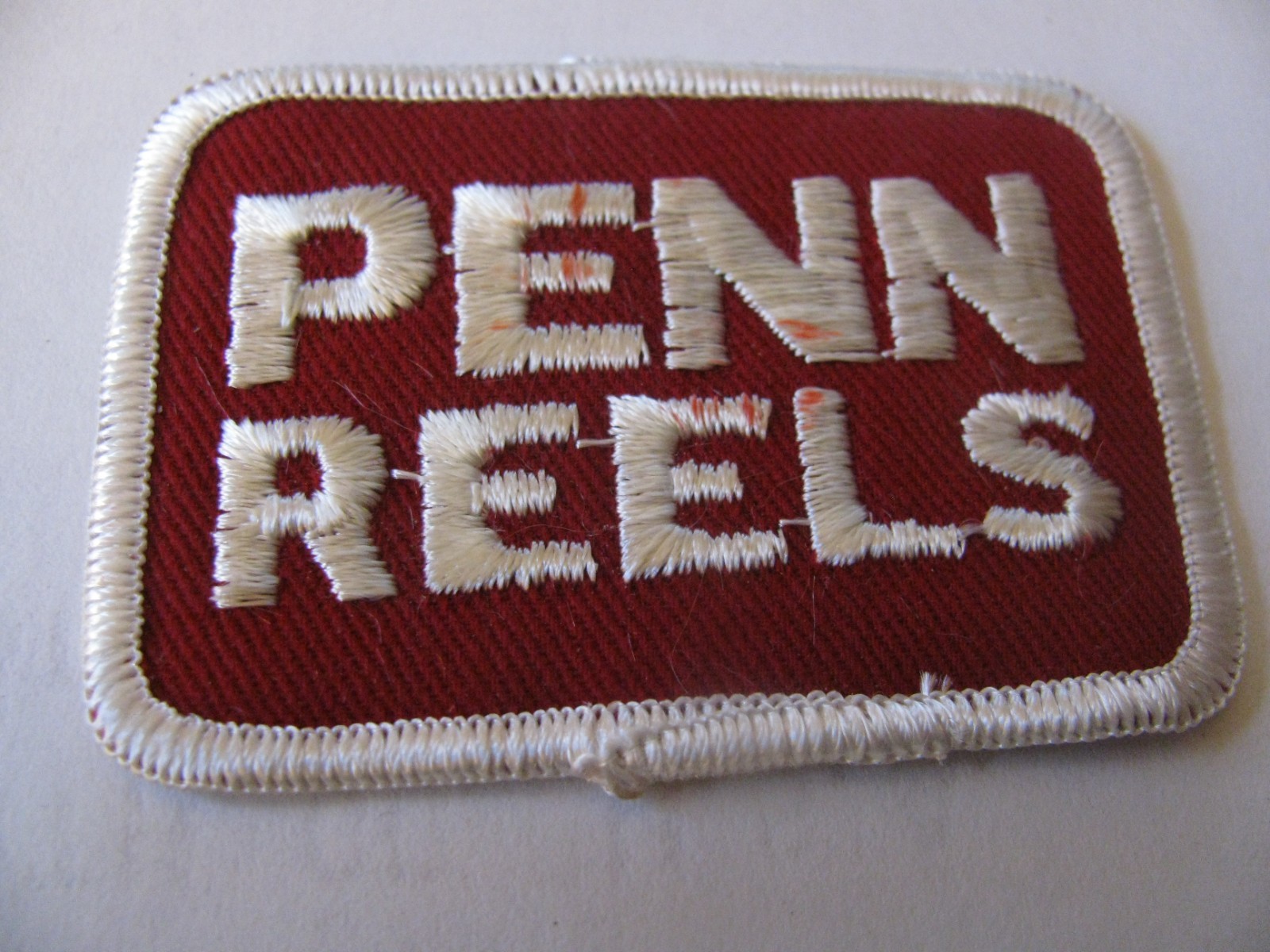 VINTAGE  PENN REELS FISHING ANGLER   3"   IRON ON EMBROIDERED PATCH LOWEST PRICE
