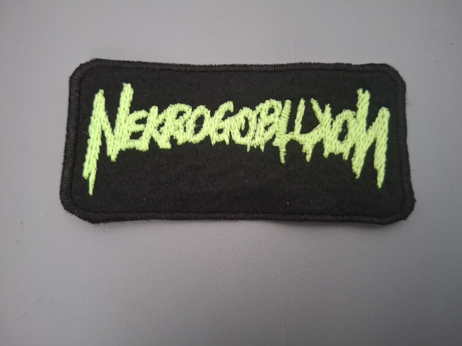 Glow In The Dark Nekrogoblikon Band Patch Black And Green