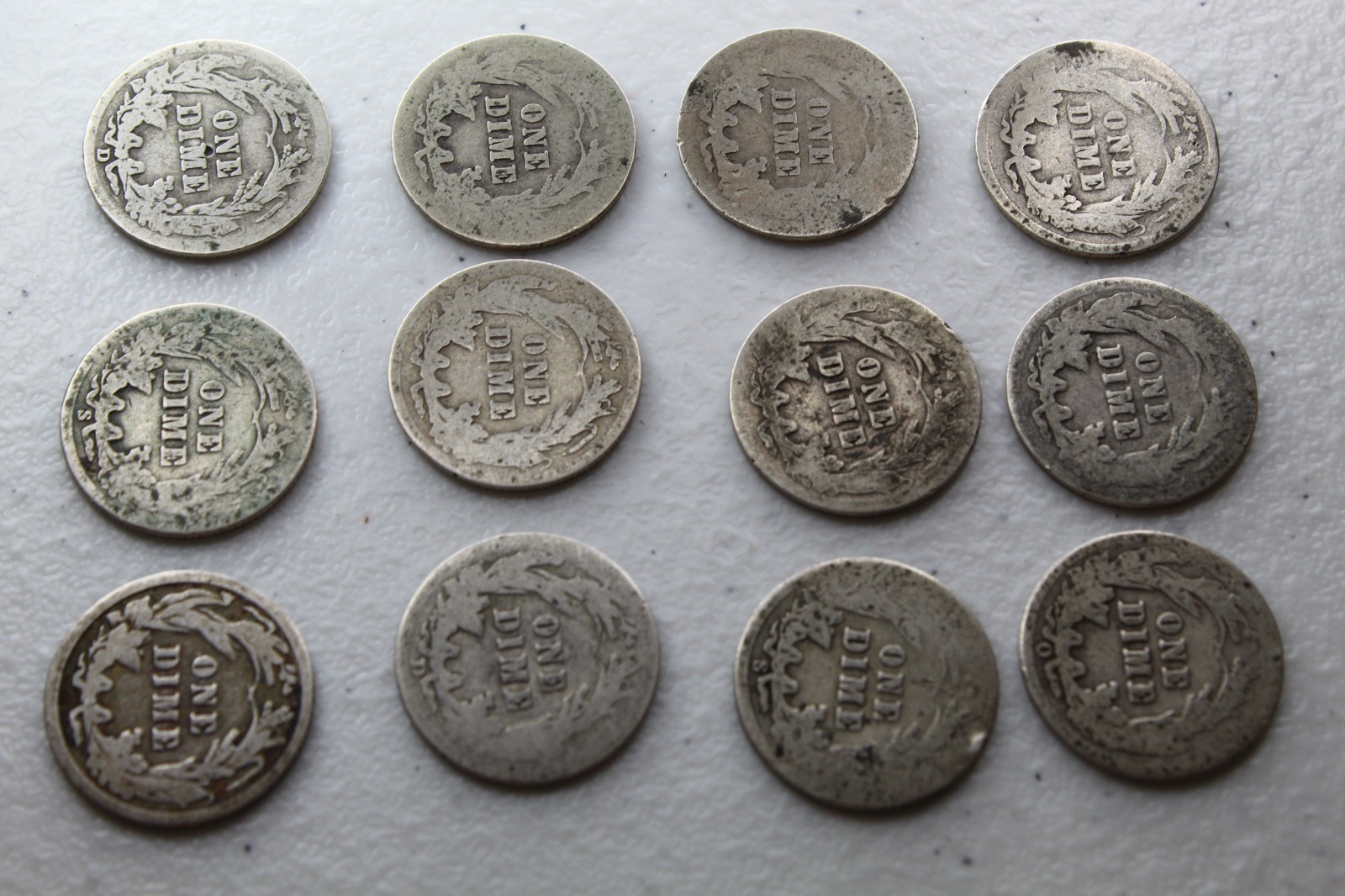 12 Very Old Very Worn Barber Dimes with dates