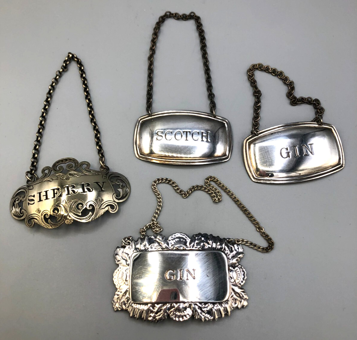 Set of 4 vintage Silverplated Liquor Labels, misc. 2", gently used