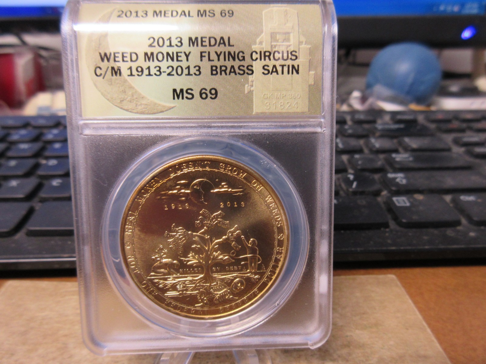 2013 Weed Money Flying Circus  HT Token / Daniel Carr Brass Satin ANACS MS 69