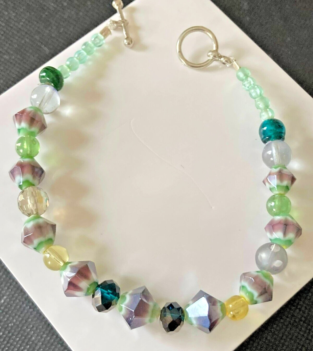 Bracelet Beaded AB and Art Glass in Purples and Greens Toggle Clasp 8"