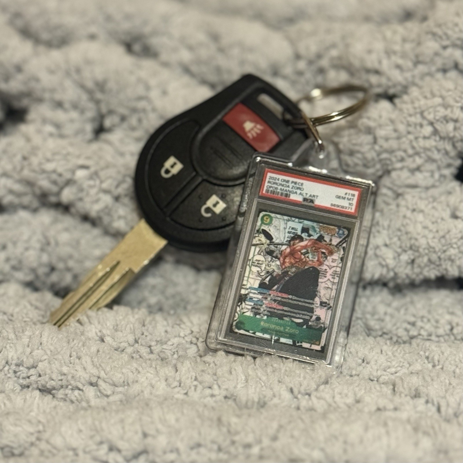 Novelty keychain One Piece x PSA 10 Roronoa Zoro Manga Alternate Art