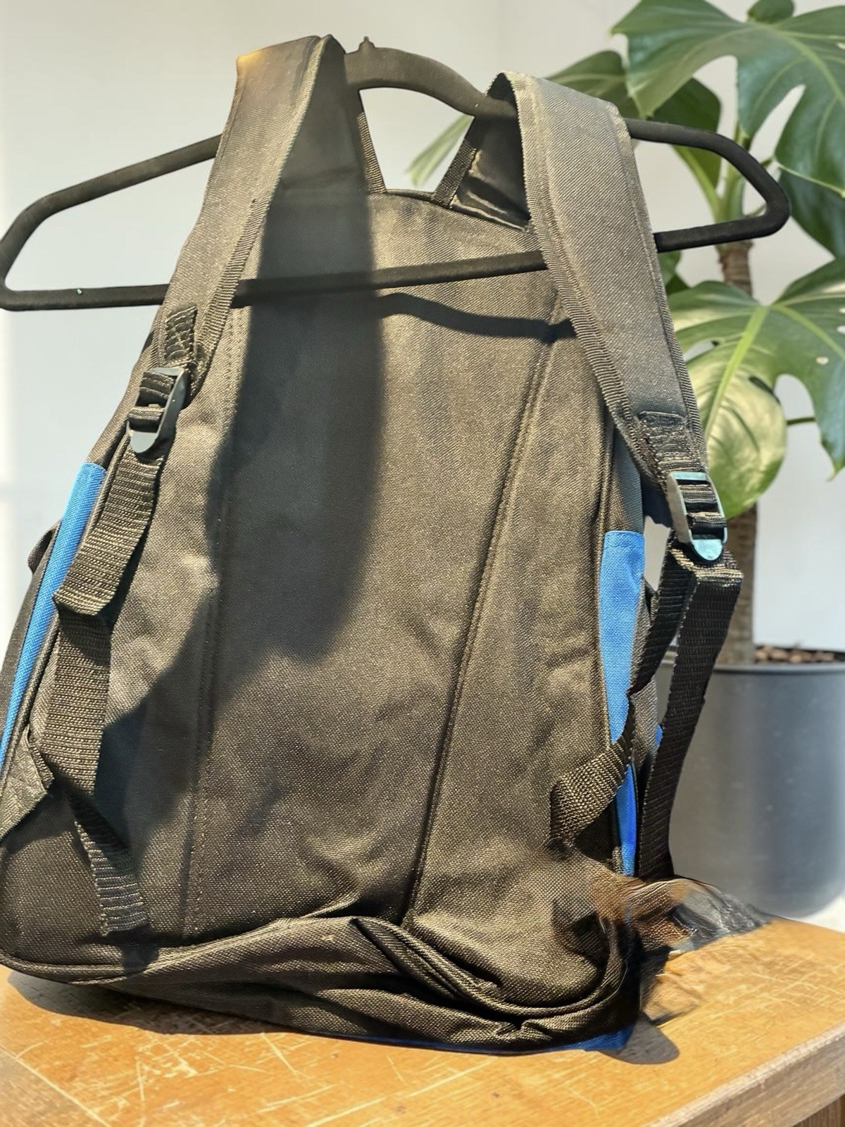 Black And Blue Backpack With Many Pockets.